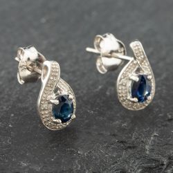 Second Hand White Gold 0.43ct Oval Cut Sapphire & 0.03ct Diamond Swirl Stud Earrings 43171088