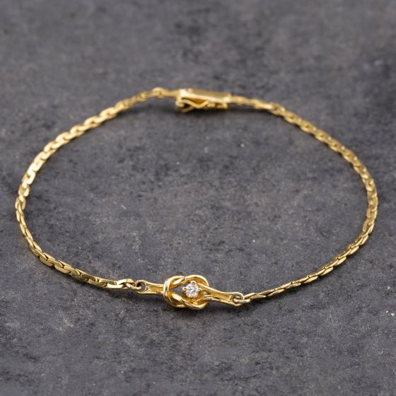 Second Hand 9ct Yellow Gold Diamond Knot Fancy 7 Inch Curb Bracelet 41061301