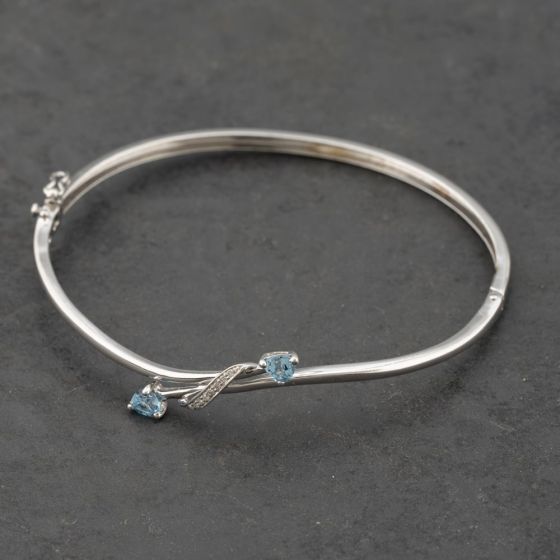 Second Hand 9ct White Gold Blue Topaz & Diamond Crossover Hinged Bangle 41211354