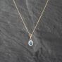 Second Hand 9ct Two Colour Gold Blue Topaz & 0.04ct Diamond Oval Cluster Pendant & 18 Inch Curb Chain 41142863
