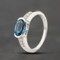 Second Hand 9ct White Gold Blue Topaz & 0.03ct Diamond Oval Cluster Ring 41383876