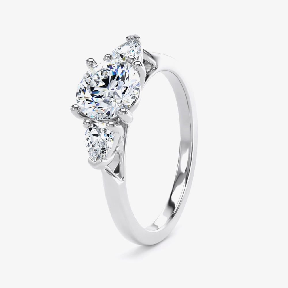 Platinum 0.70ct Brilliant Cut & Pear Cut Diamond Three Stone Ring