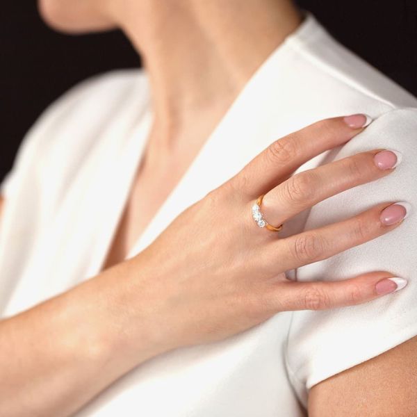 1888 collection gold rings on finger