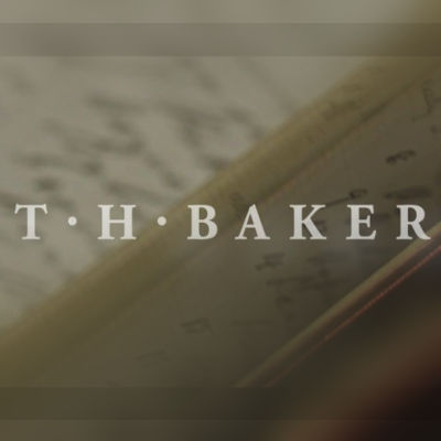 T H Baker logo over a faded image of a book.